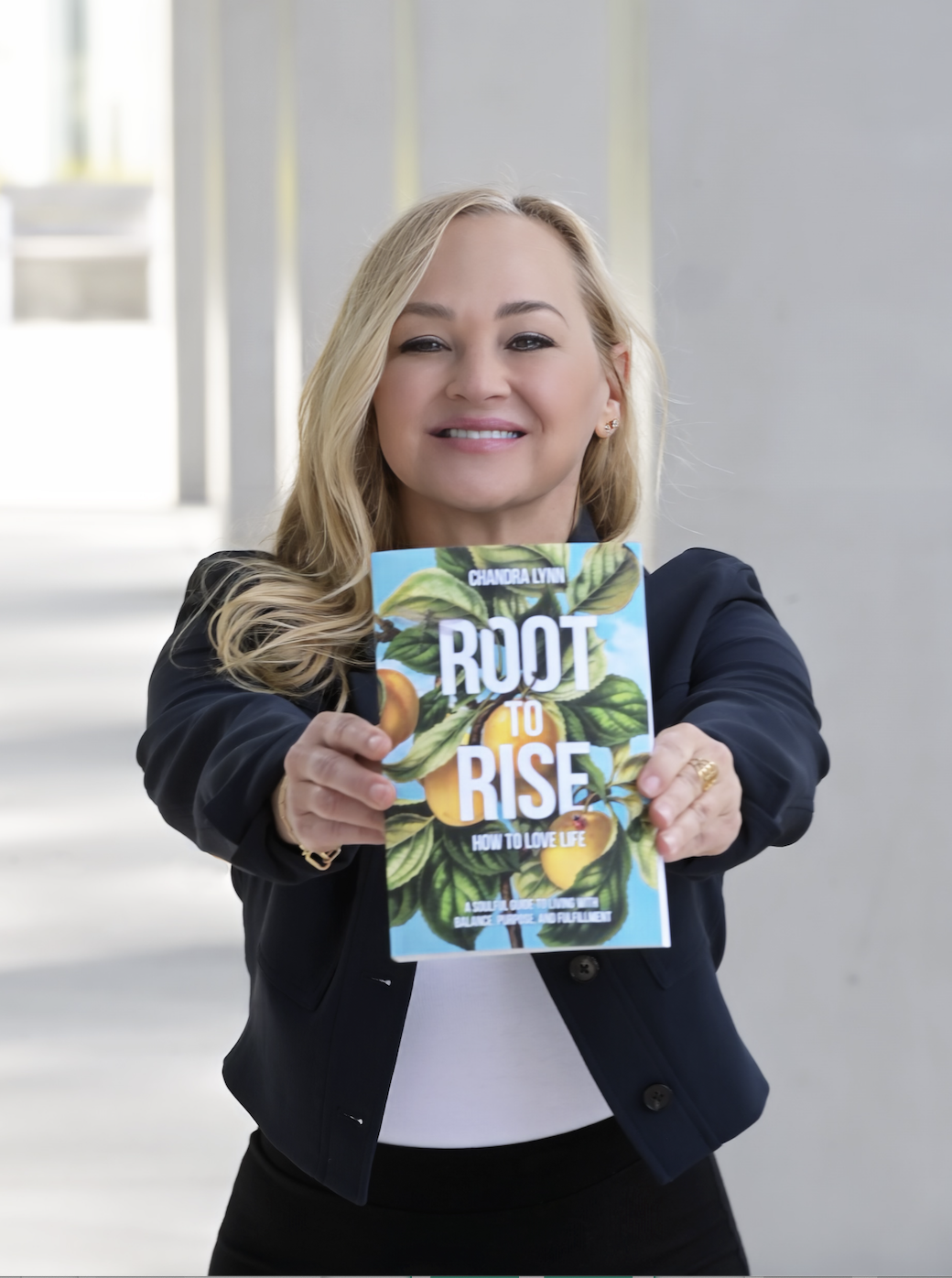 Chandra Lynn holding Root-to-Rise: How to Love Life